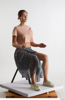  Cynthia  1 casual dressed floral skirt pink crop t shirt sitting whole body yellow sneakers 0014.jpg